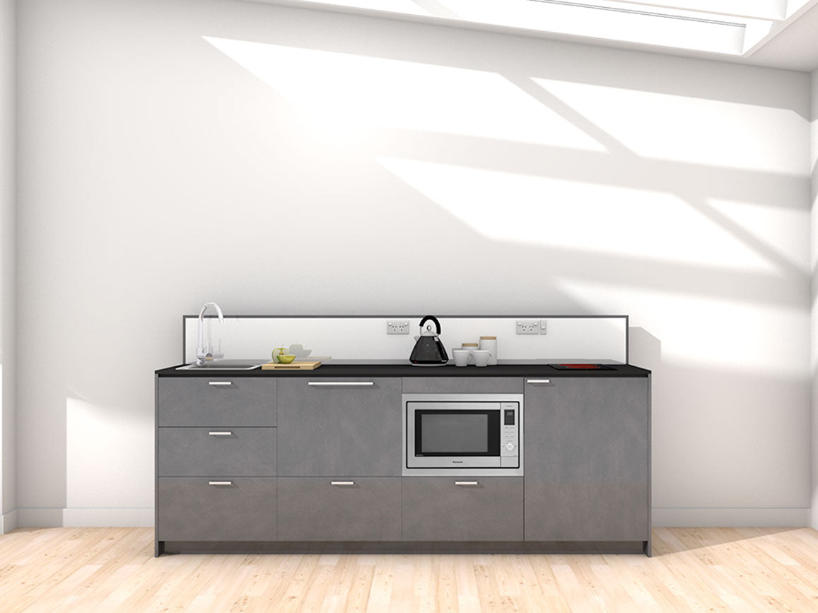 Moana - 2.4m Extended Counter Unit Kitchenette. Displayed with 'Slate' Cabinetry, 'Black' Benchtop, and 'Sheer Bliss White' Splashback